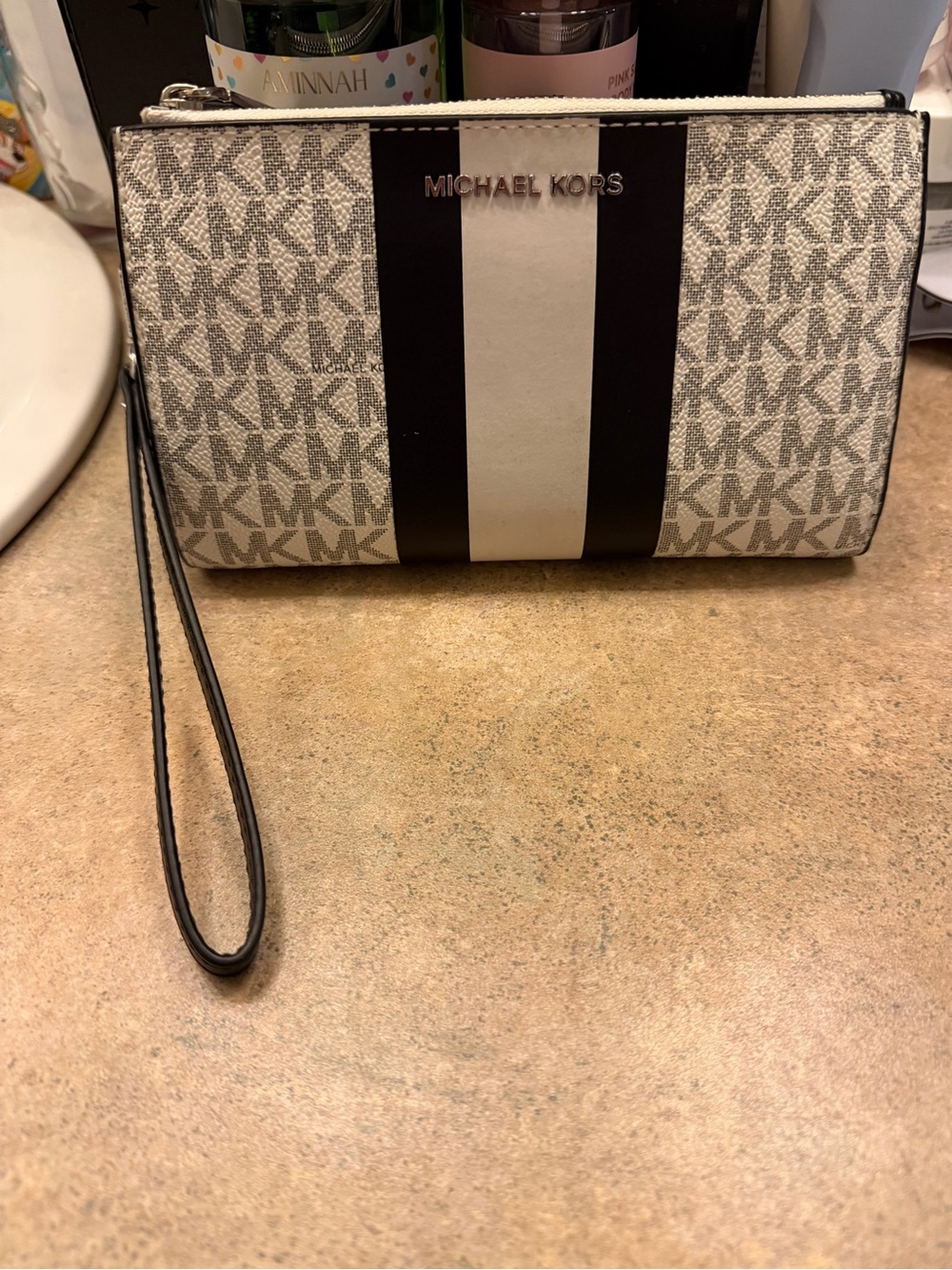 Like new- very lightly used- Michael Kors Signature Stripe Wristlet